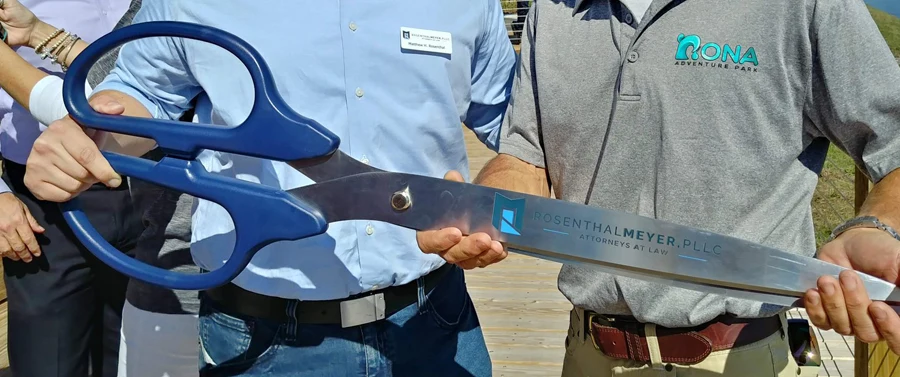 Oversized blue-handled ceremonial ribbon-cutting scissors